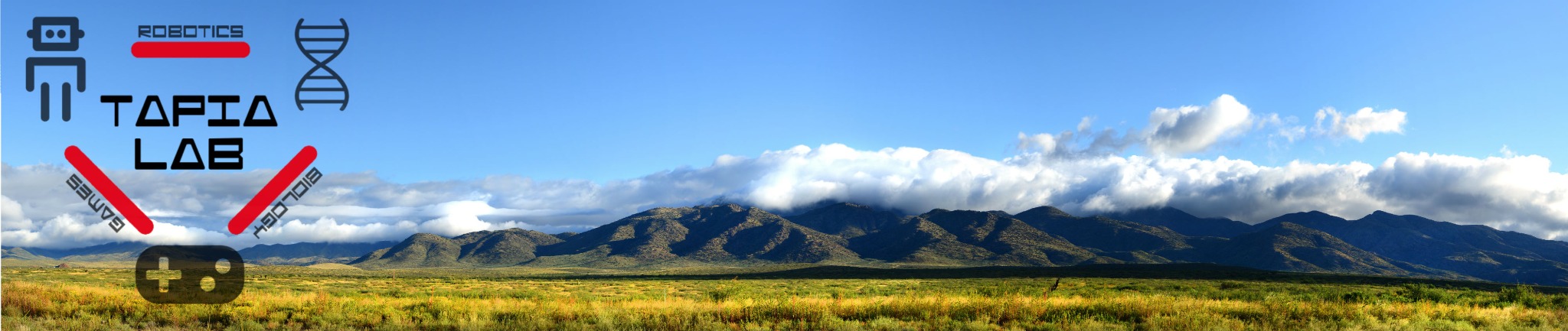 Mountain landscape beneath a blue New Mexico sky